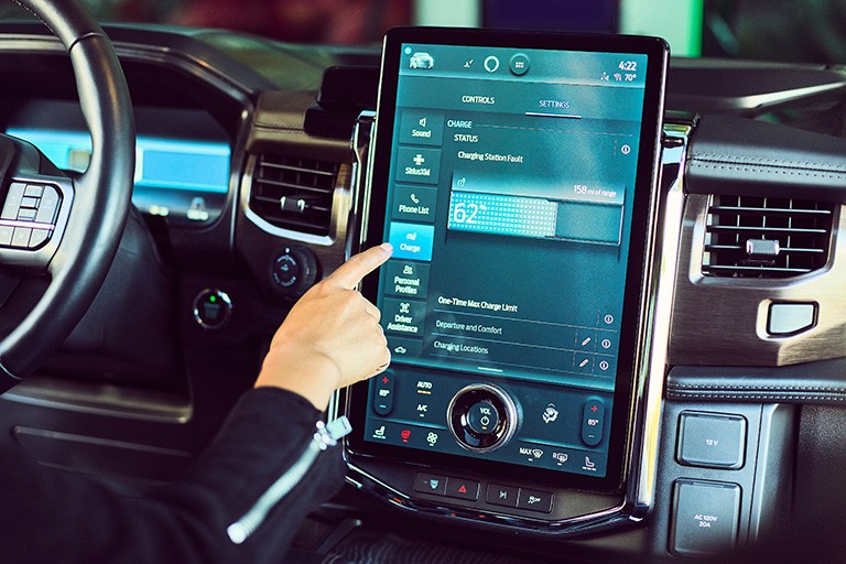 A finger adjusts a control on a SYNC 4 touchscreen