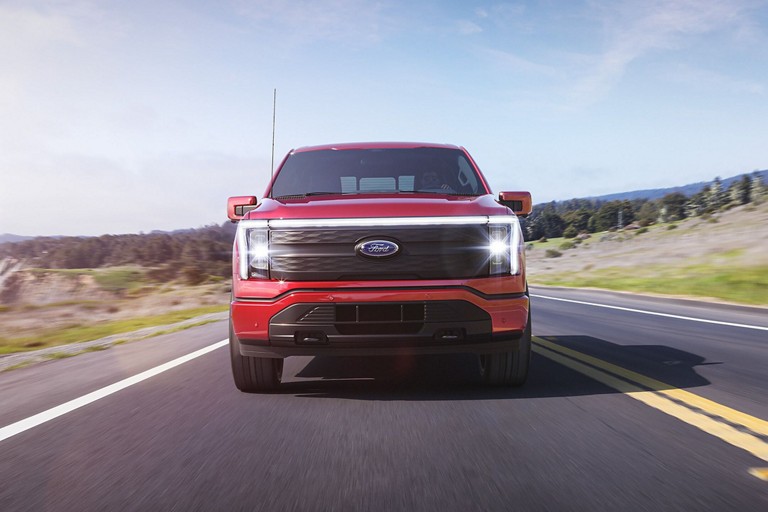 F-150 Lightning driving on a highway.