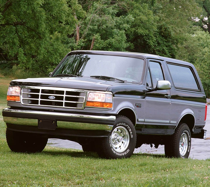1995 Ford Bronco x l t parked on grass