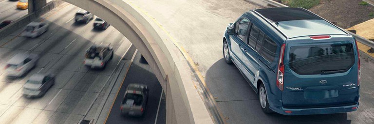 Ford Transit driving over a curved overpass