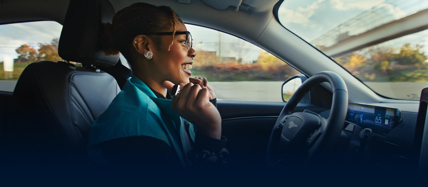 A person drives a Ford vehicle hands-free.