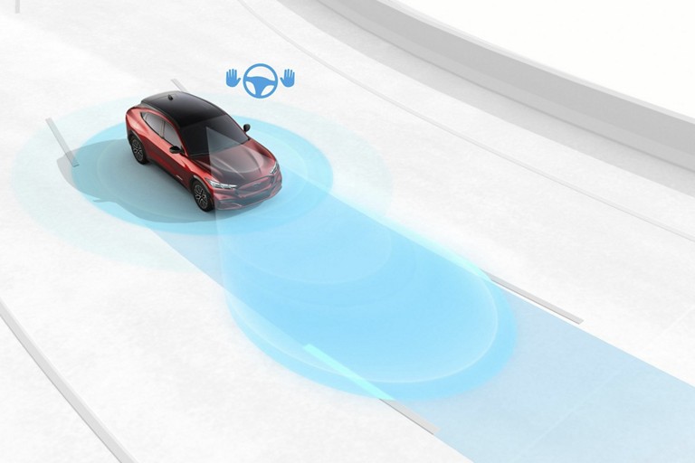 Illustration of vehicle being driven down road, areas of perception highlighted in blue.