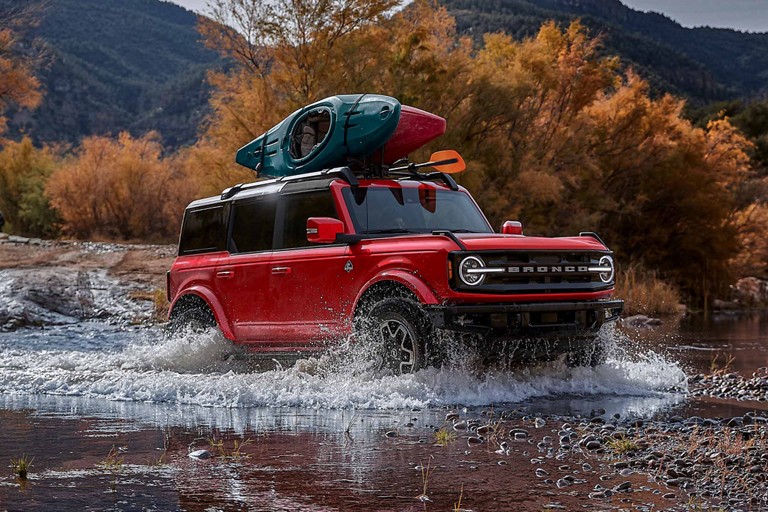 Ford Bronco crossing a small body of water.