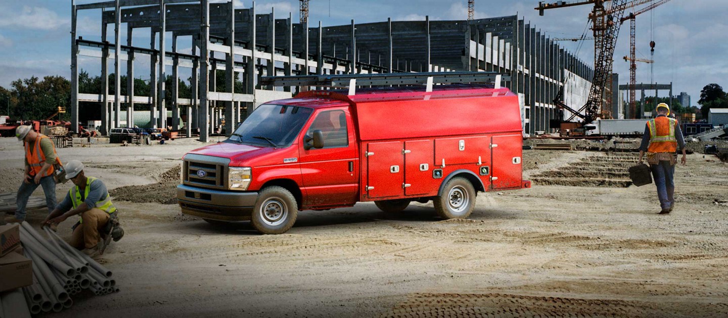 2025 Ford E-Series Cutaway with drive upfit parked at construction site