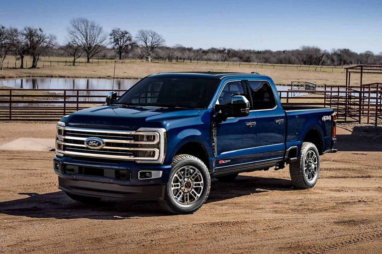 2025 Ford Super Duty® pickup in Atlas Blue parked at a farm
