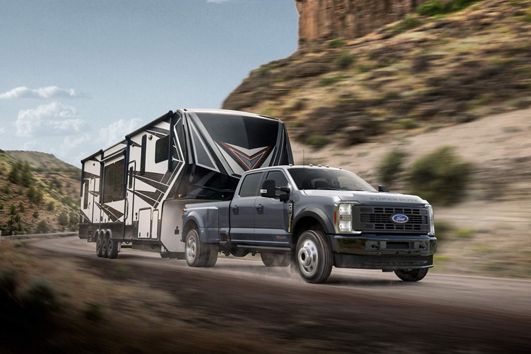 2025 Ford Super Duty® F-450® DRW Limited pickup pulling a large camper