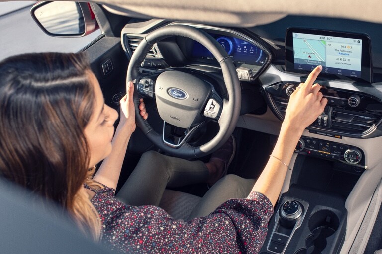 Female driver using touchscreen in the 2021 Ford Escape Titanium