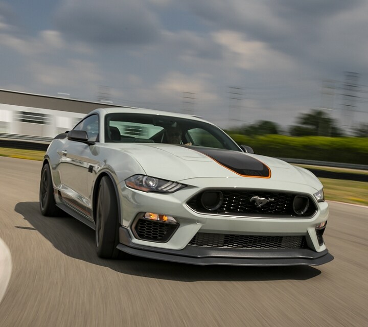 A 2021 Ford® Mustang Mach 1 being driven on a track