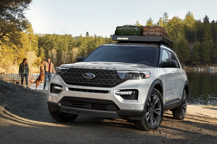 The 2023 Ford Explorer parked at a lakeshore.