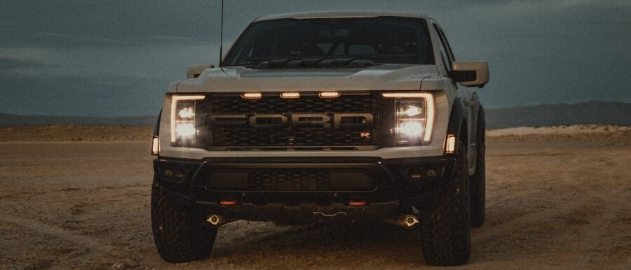 2023 Ford F-150® Raptor® R parked in the desert showing grille and headlights