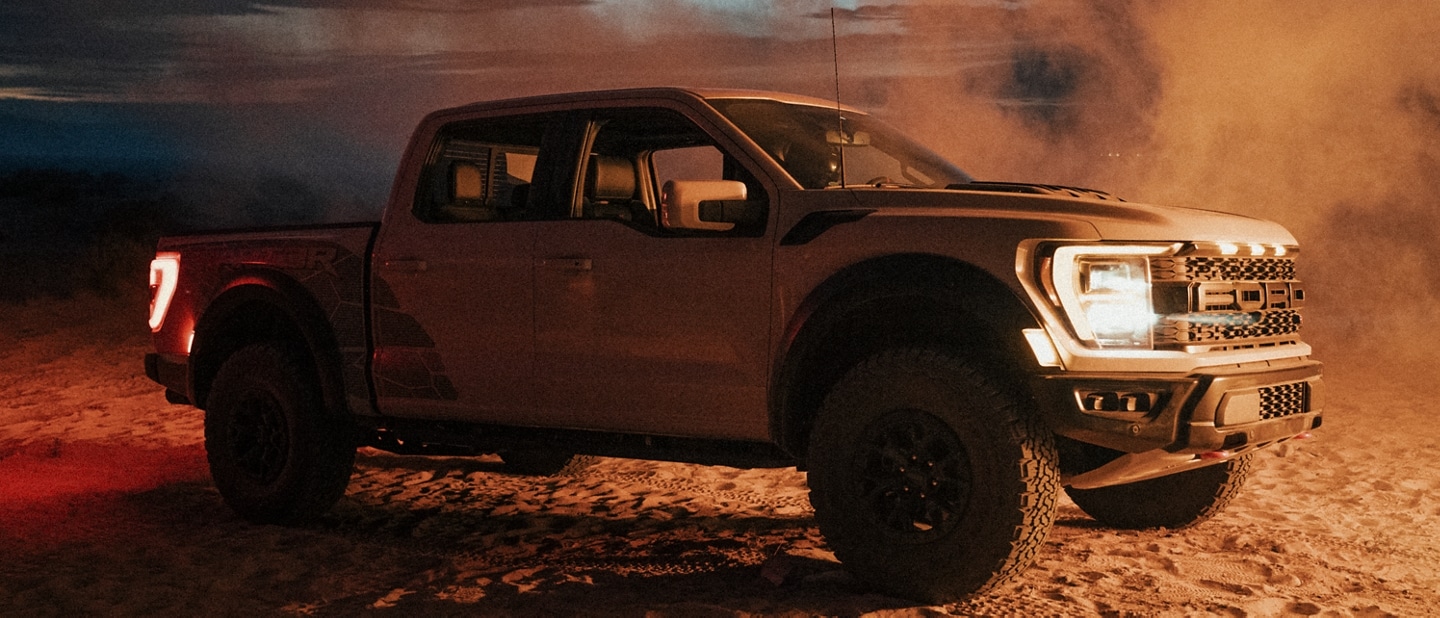 Image of the 2023 Ford F-150® Raptor® R parked in desert with dust blowing 