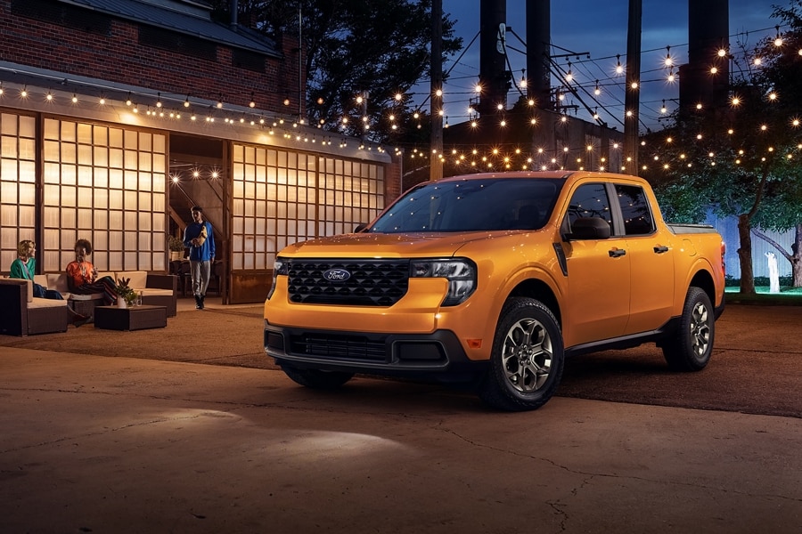 2026 Ford Maverick® pickup parked near a building under lights at night