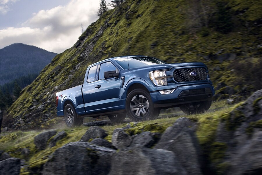 2022 F-150® with STX Appearance Package being driven on a mountain road