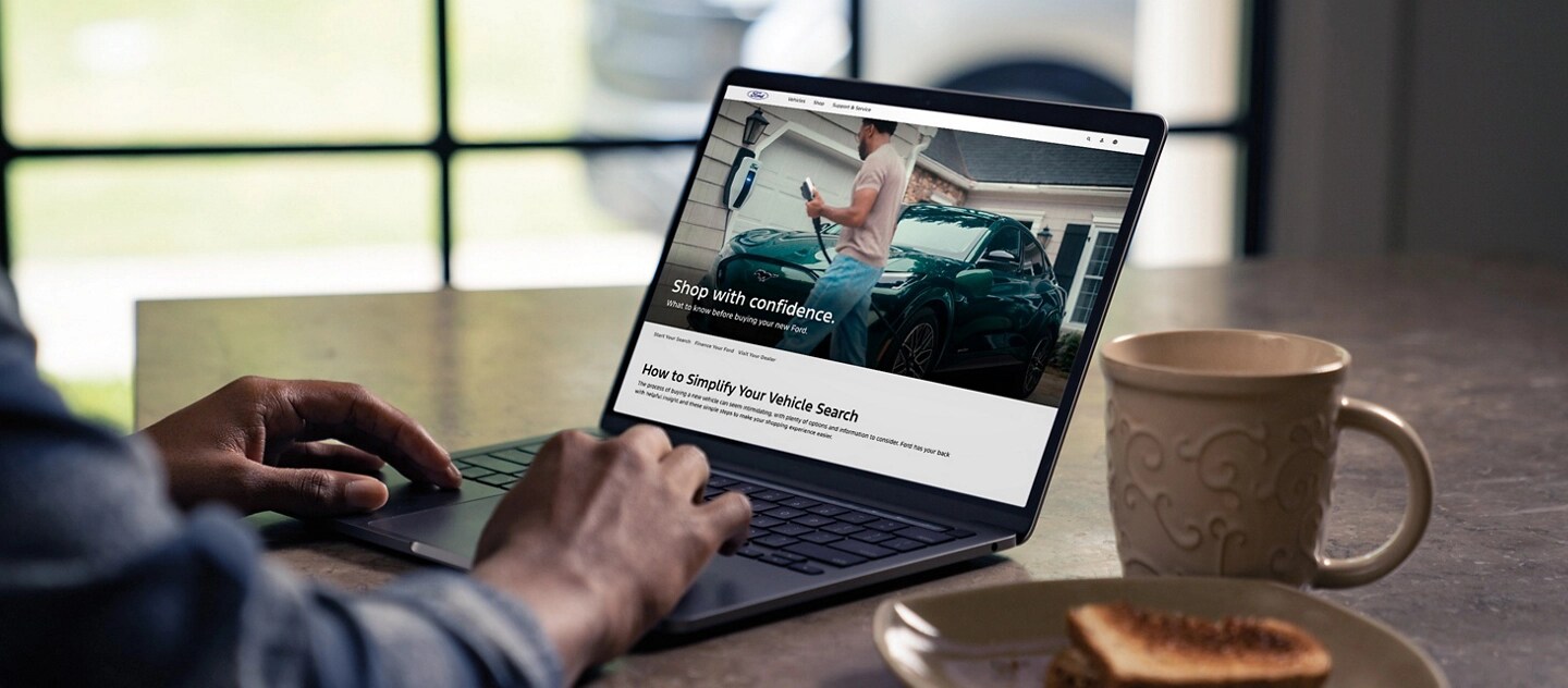 Person browsing the Shop page on a laptop.