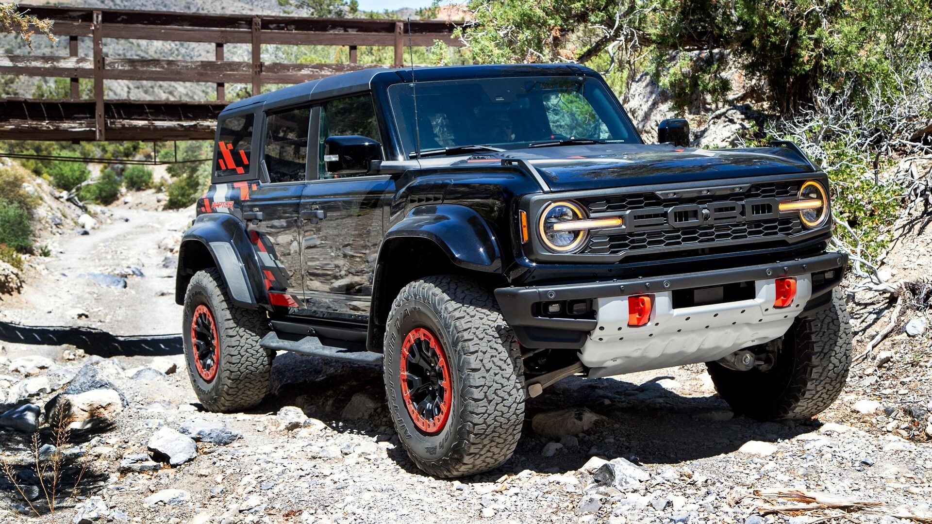 A 2025 Ford Bronco® SUV parked on a dry, rocky streambed