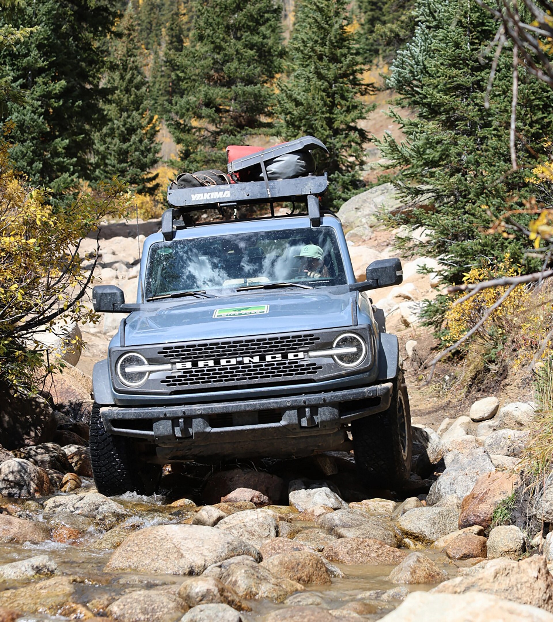 A 2025 Ford Bronco® SUV driving on a rocky trail
