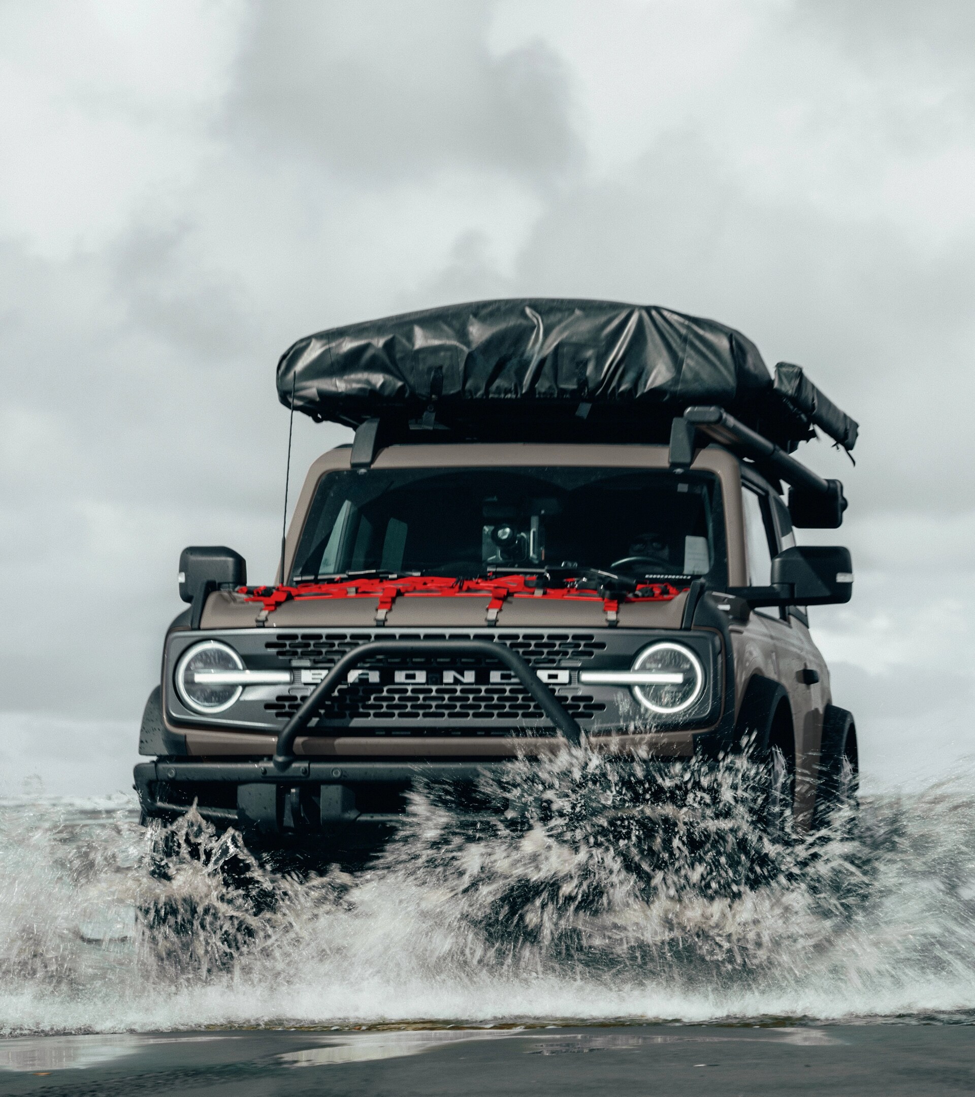 A 2025 Ford Bronco® SUV driving in water