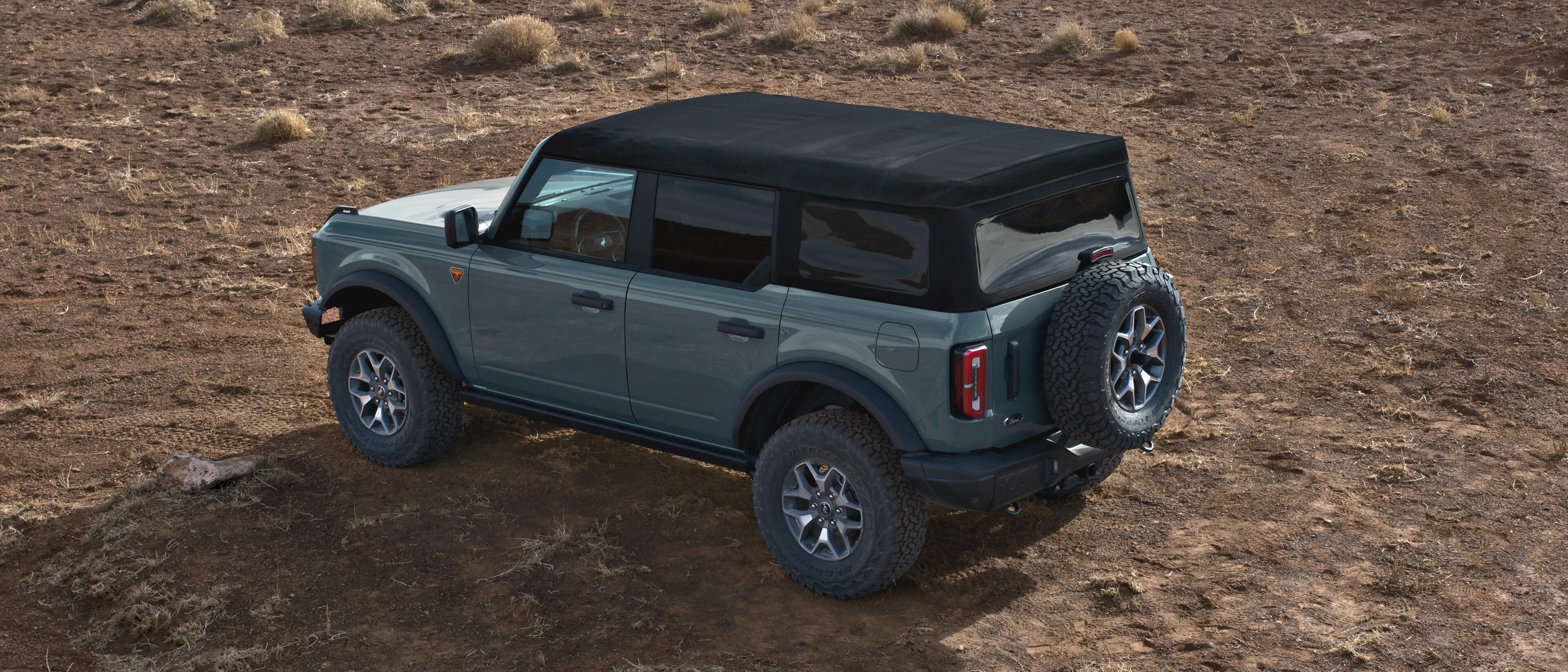 A 2025 Ford Bronco® SUV parked on a mud flat
