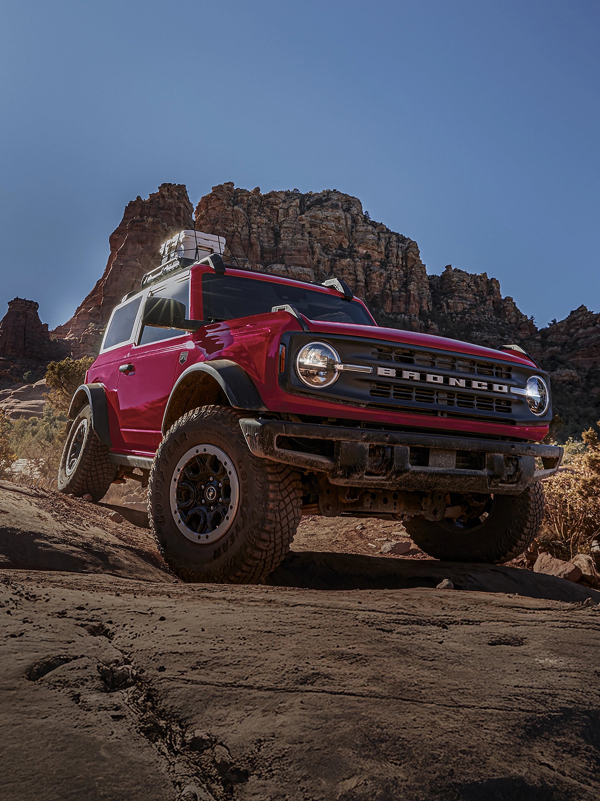 A 2026 Ford Bronco® SUV with the available Sasquatch® Package descending a muddy hill