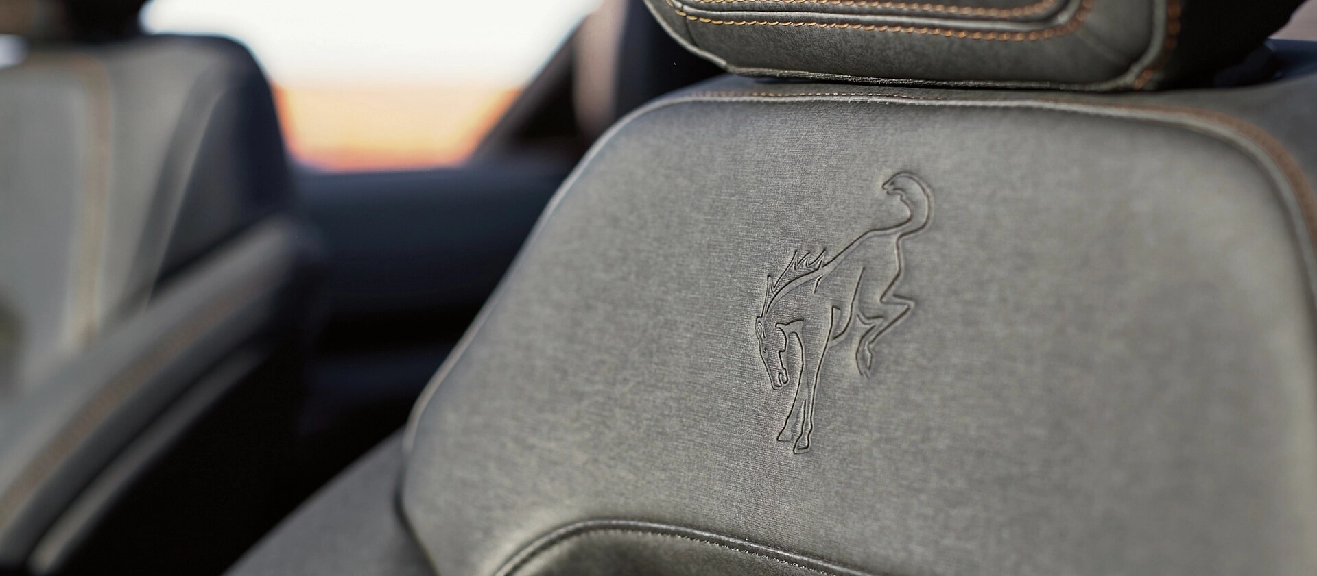 The embossed Bronco logo on the front seat of a 2026 Ford Bronco® SUV