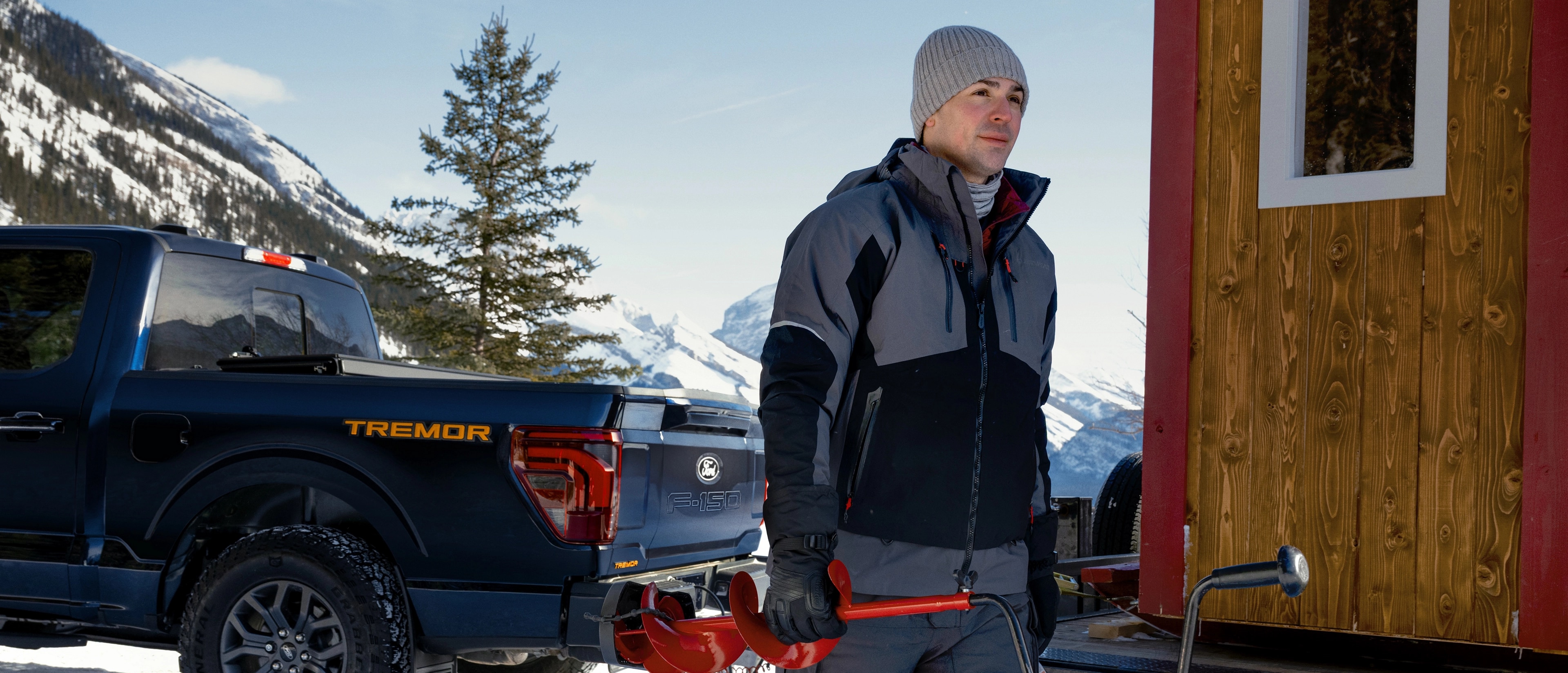 Carey Price stands in front of an F-150 Tremor on a snowy mountain road.