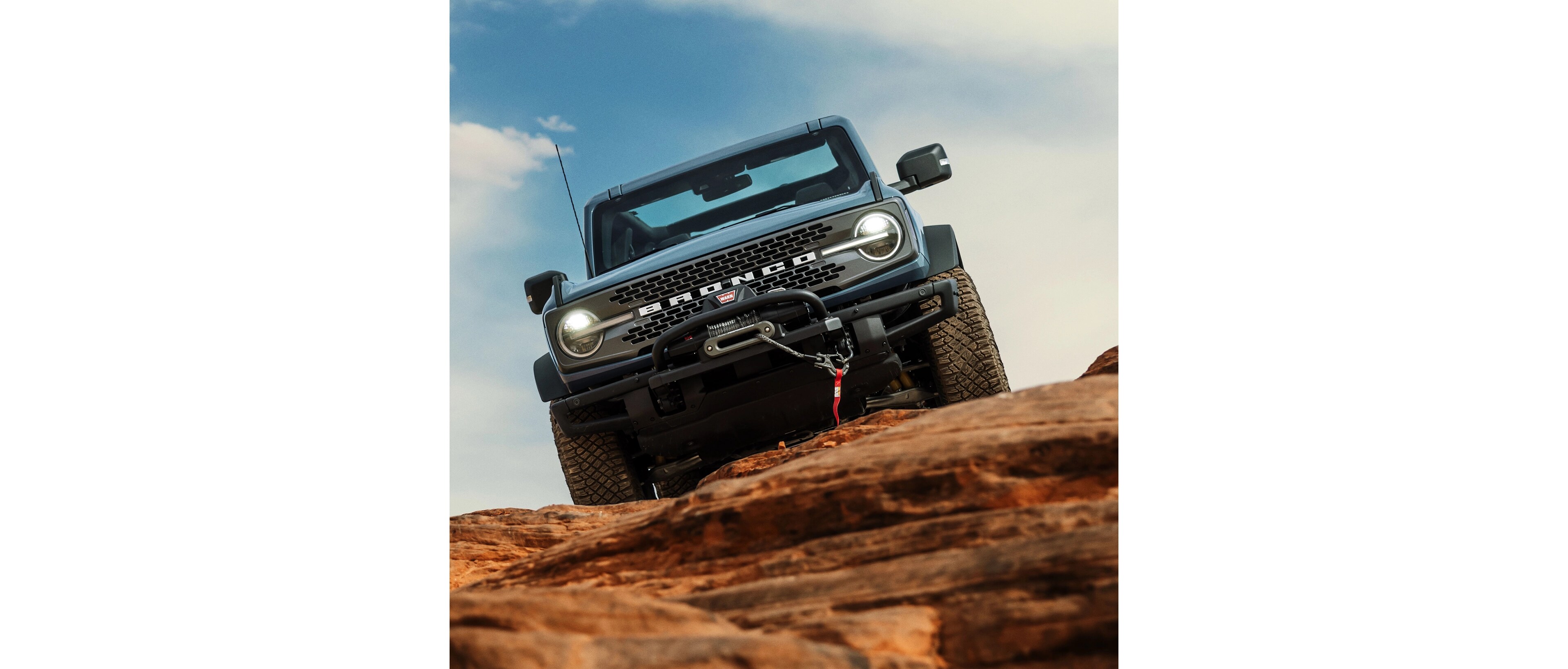 The Bronco descending rocky terrain. 