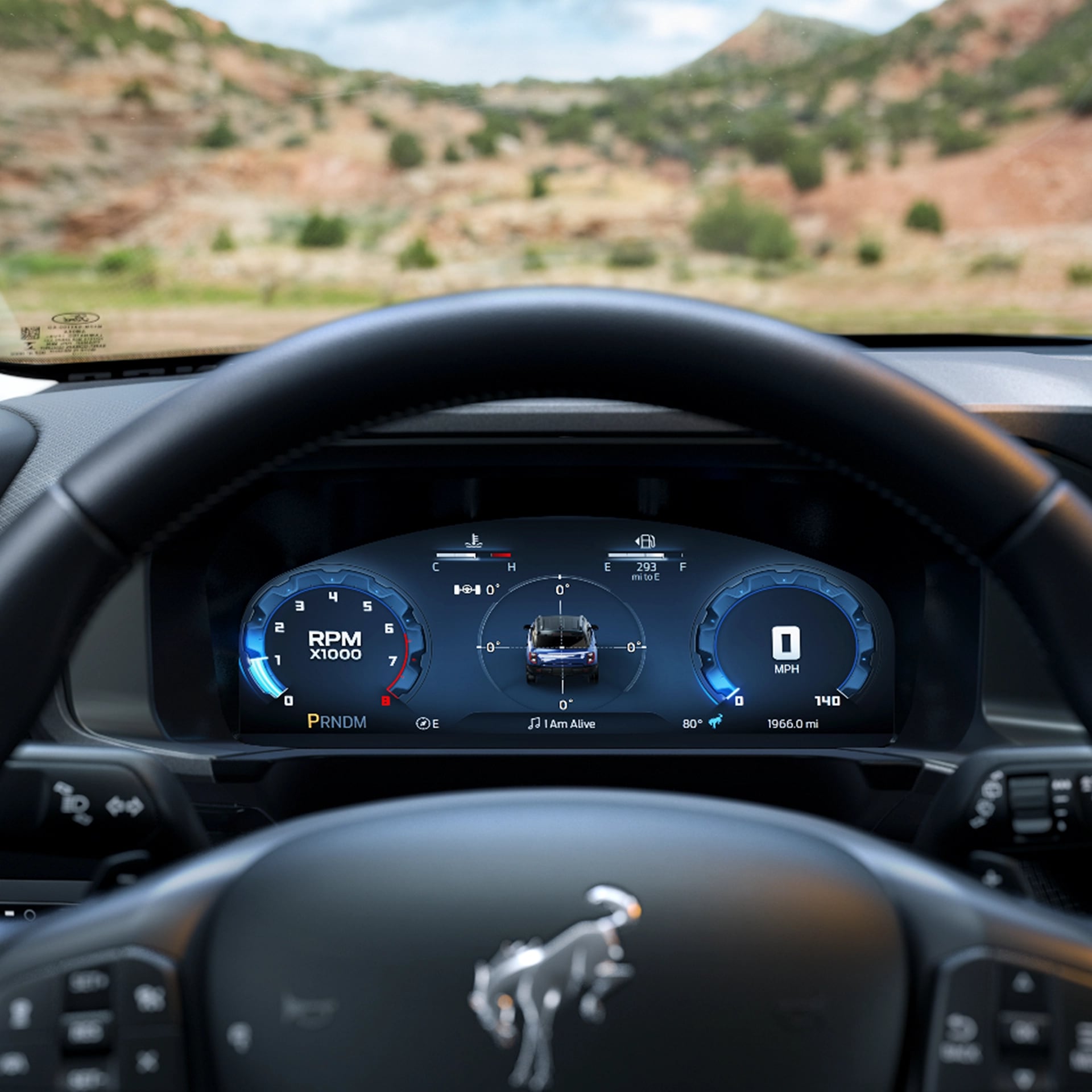 A close-up view of the Bronco Sport’s steering wheel and instrument cluster. 