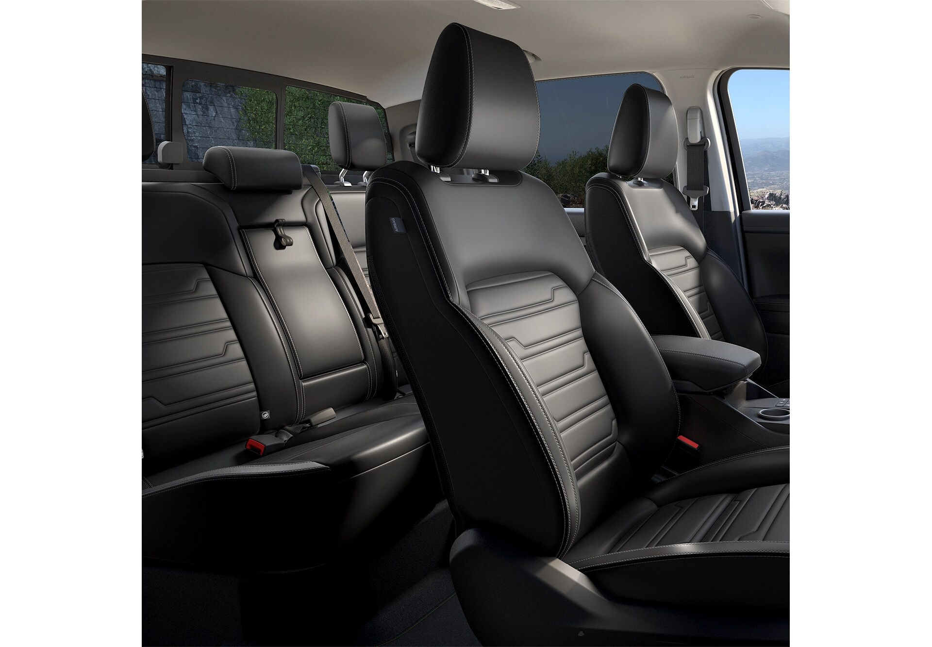 Three-quarter interior view of black leather front and rear of a Ford Ranger. 