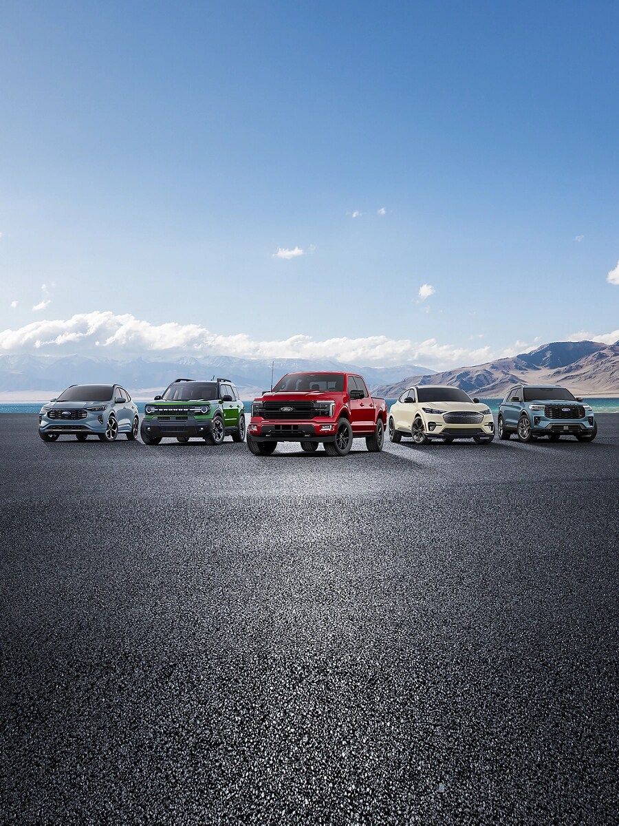 The lineup of Ford vehicles is shown from left to right: Escape, Bronco Sport, F-150, Mach-E, and Explorer. 