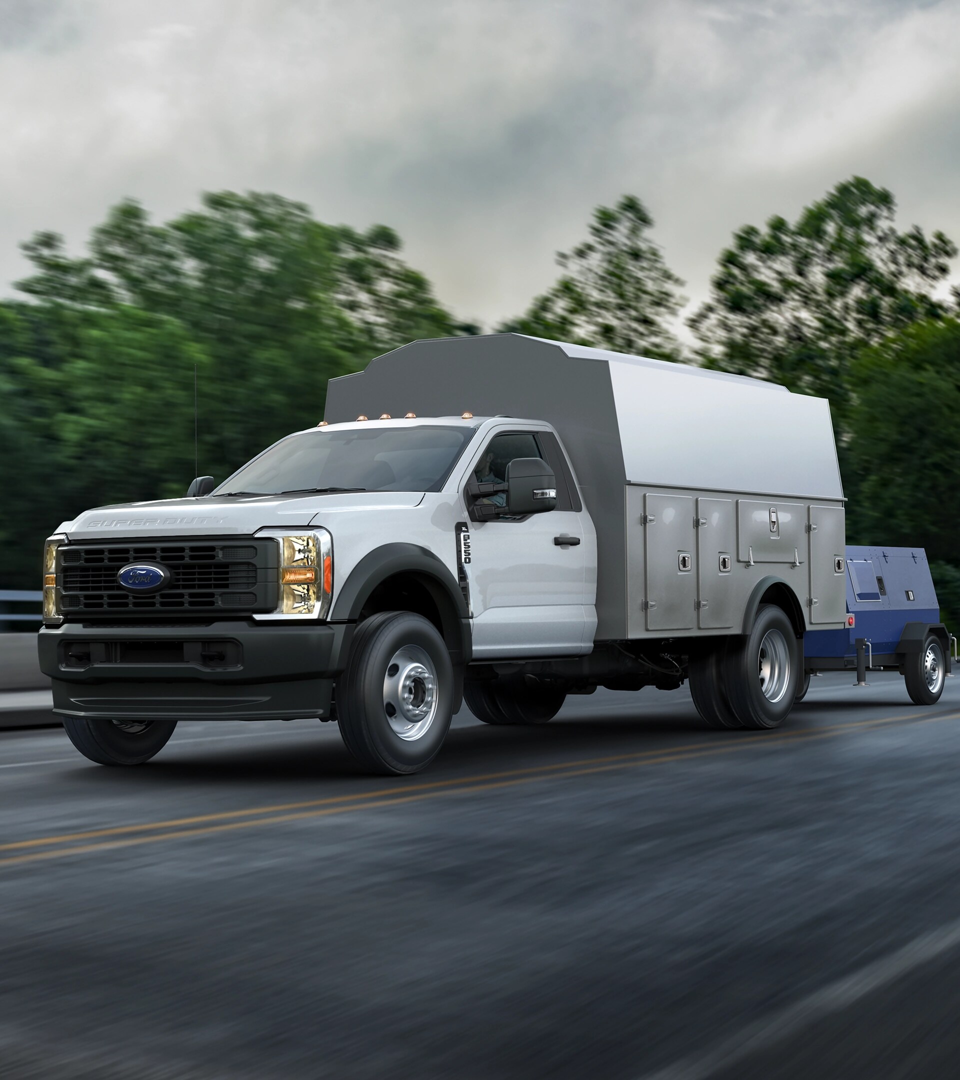 A 2026 Ford Super Duty® Chassis Cab with a utility box towing a generator