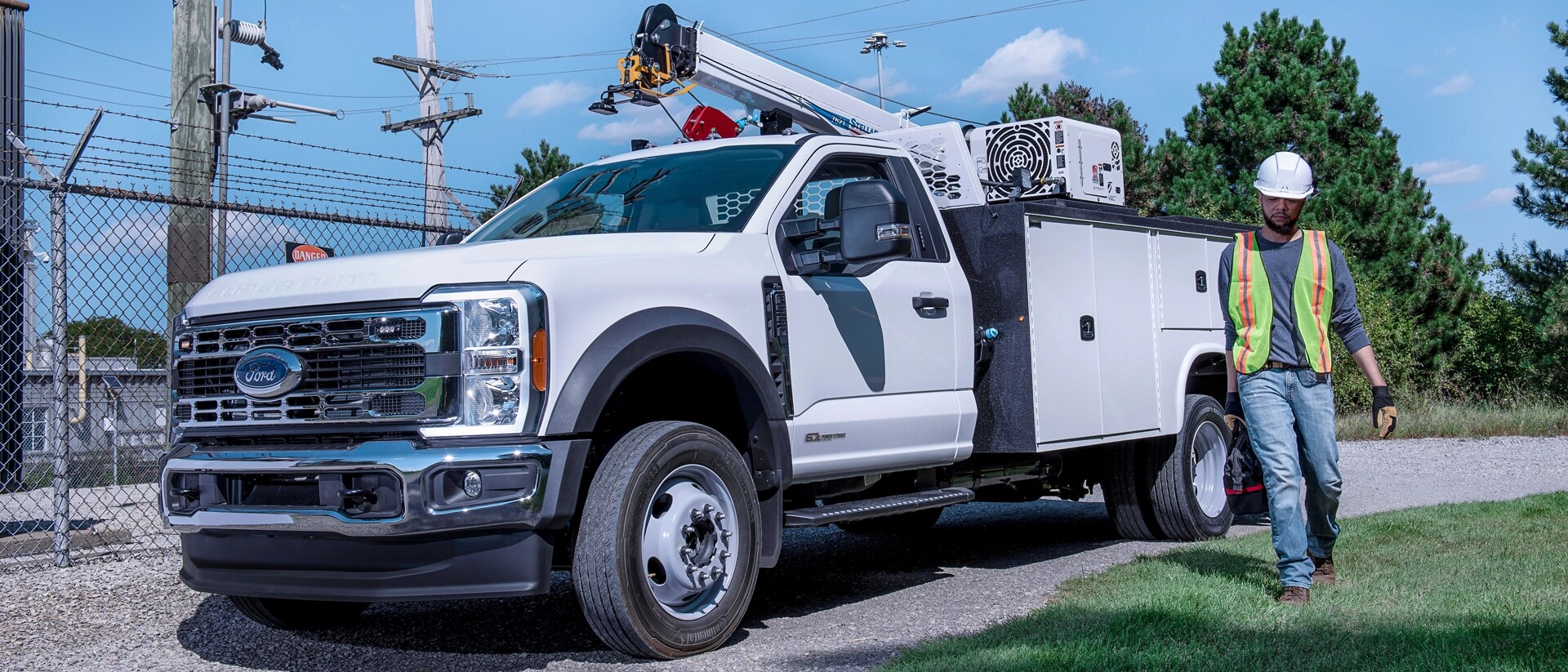 A 2026 Ford Super Duty® Chassis Cab with a boom extension and utility box on it
