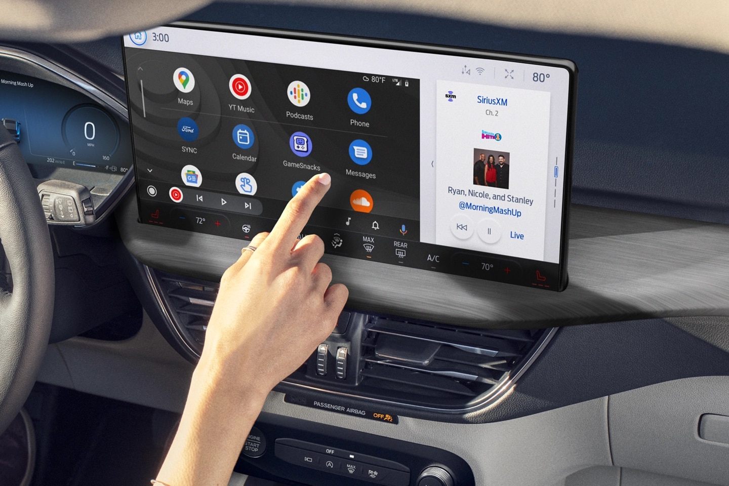 Person interacting with the centre touch screen in a Ford vehicle.