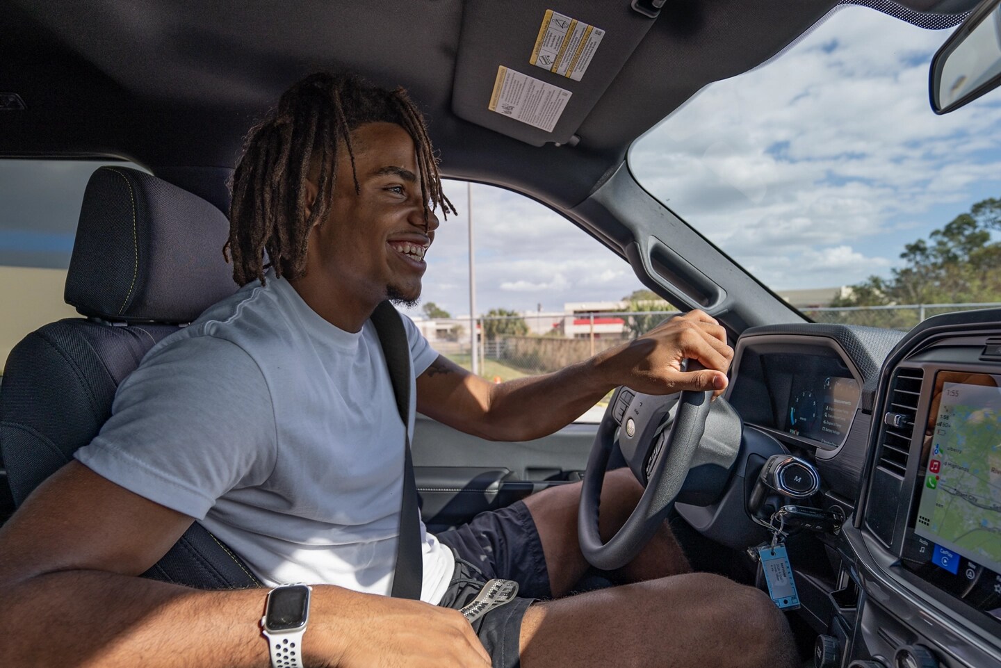 Person driving a Ford vehicle.