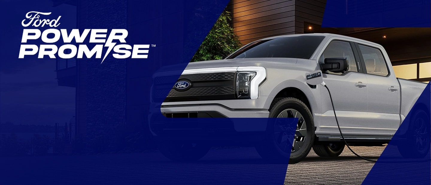 Ford Power Promise logo. A grey Ford F-150 Lightning charging outside a home. 