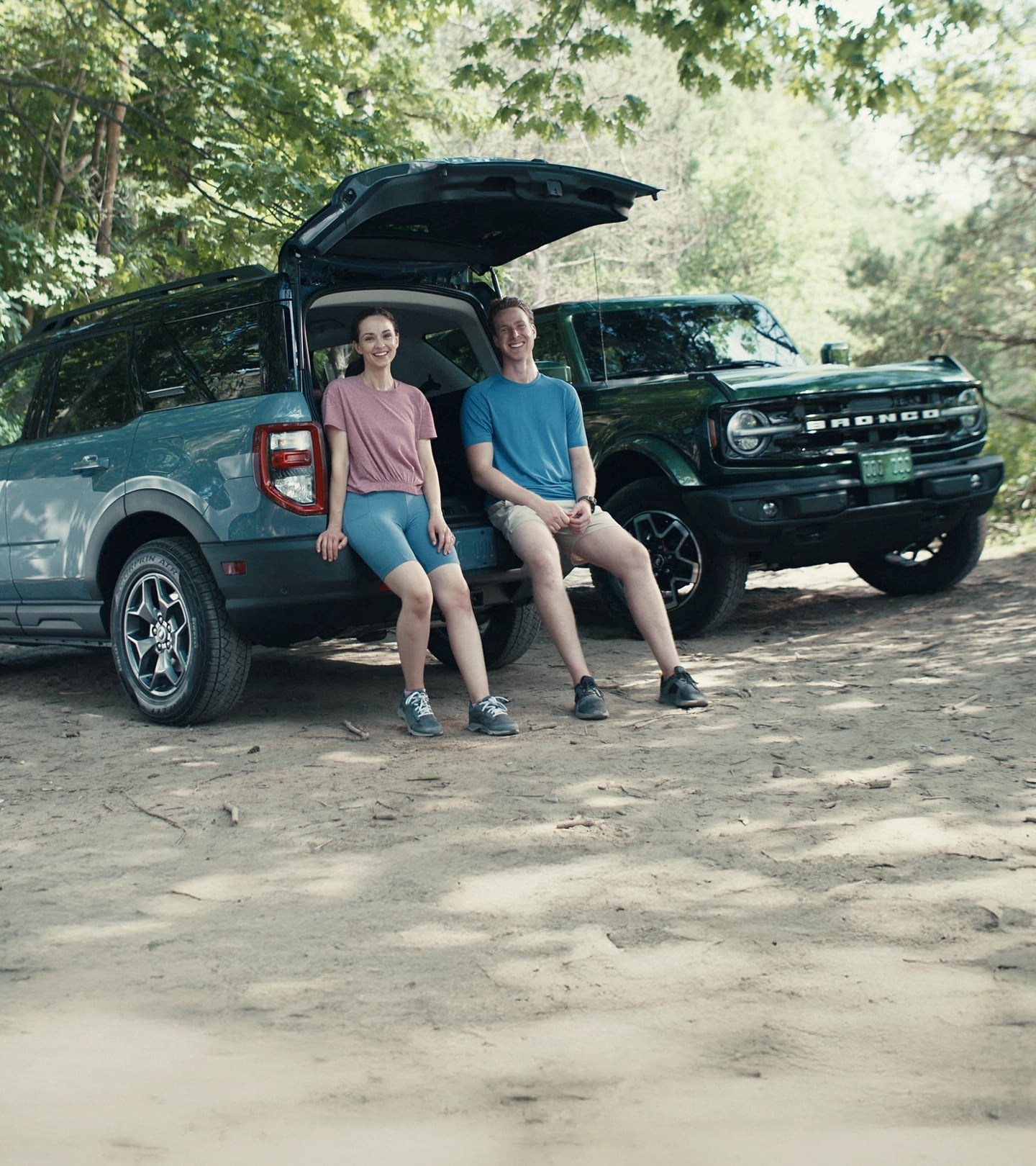 Two Ford of Canada Employees beside a 2025 Ford Bronco Sport® and 2025 Ford Bronco® 