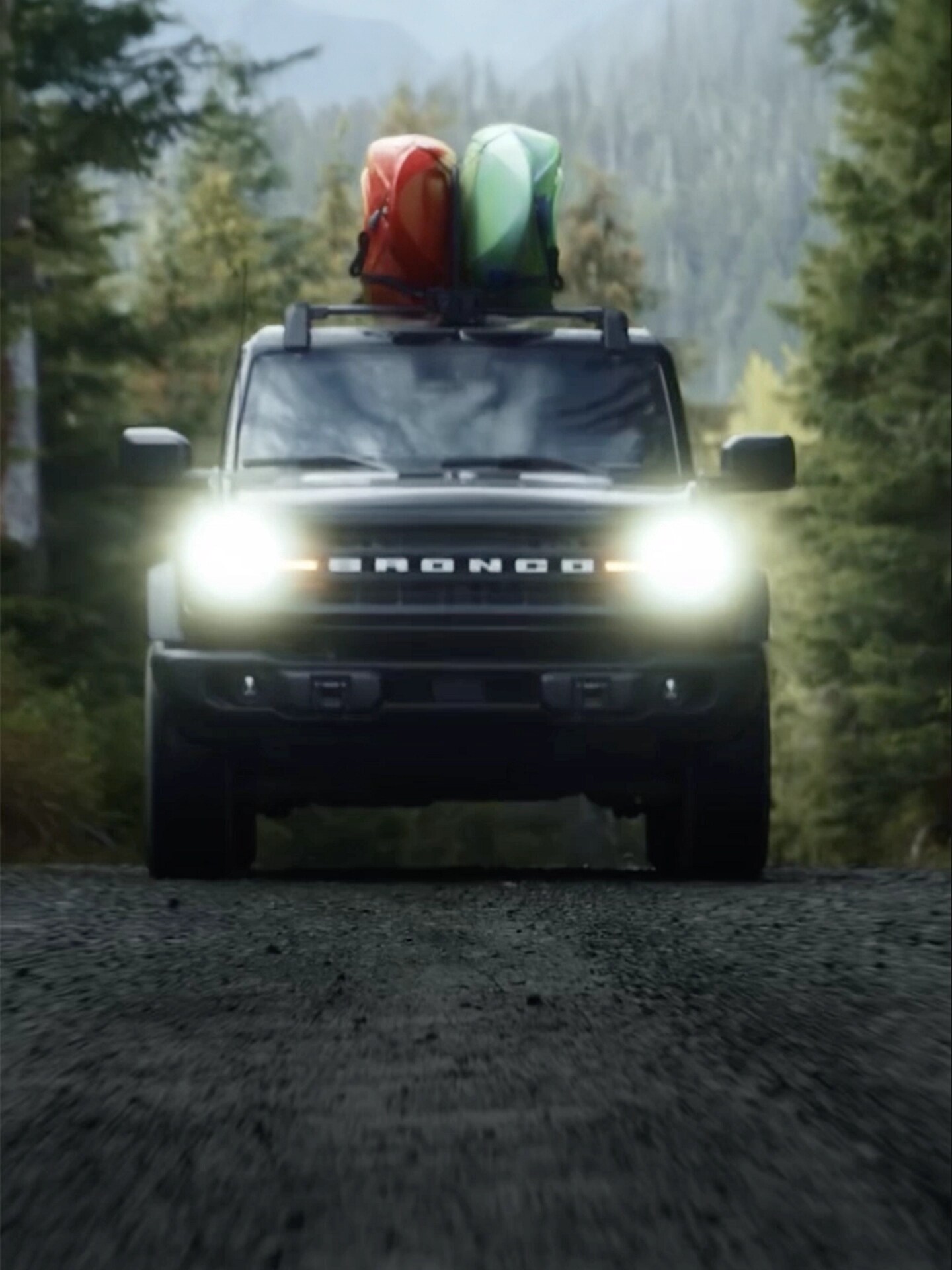 Ford SUVs and cars driving on varying terrain.