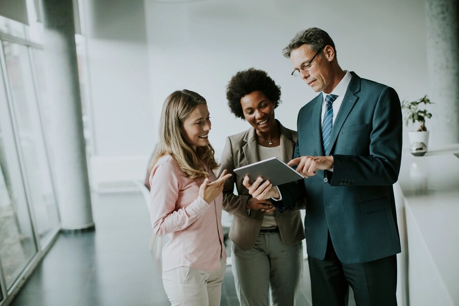 Group of business people using a tablet.