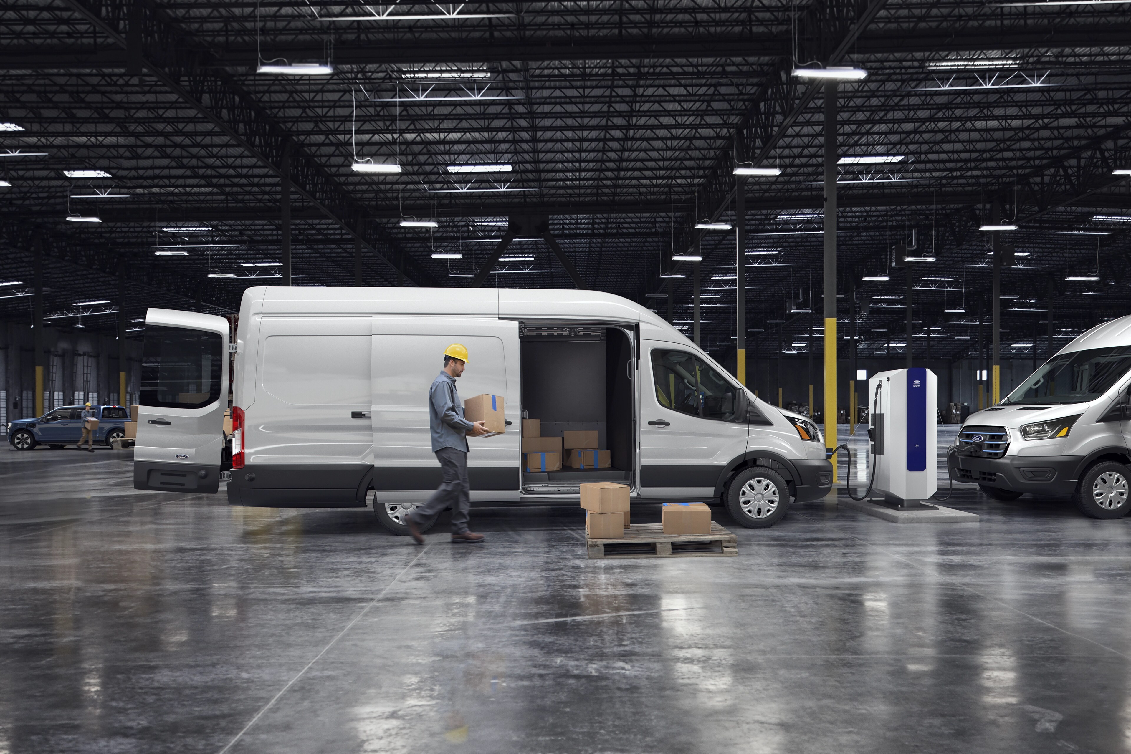A white 2025 Ford E-Transit™ van parked in a warehouse