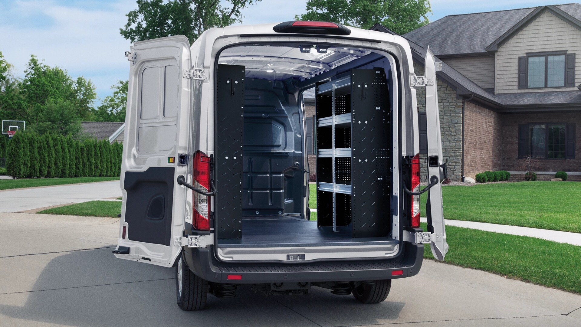 A 2025 Ford E-Transit™ van with rear doors open to show liner wall shelving