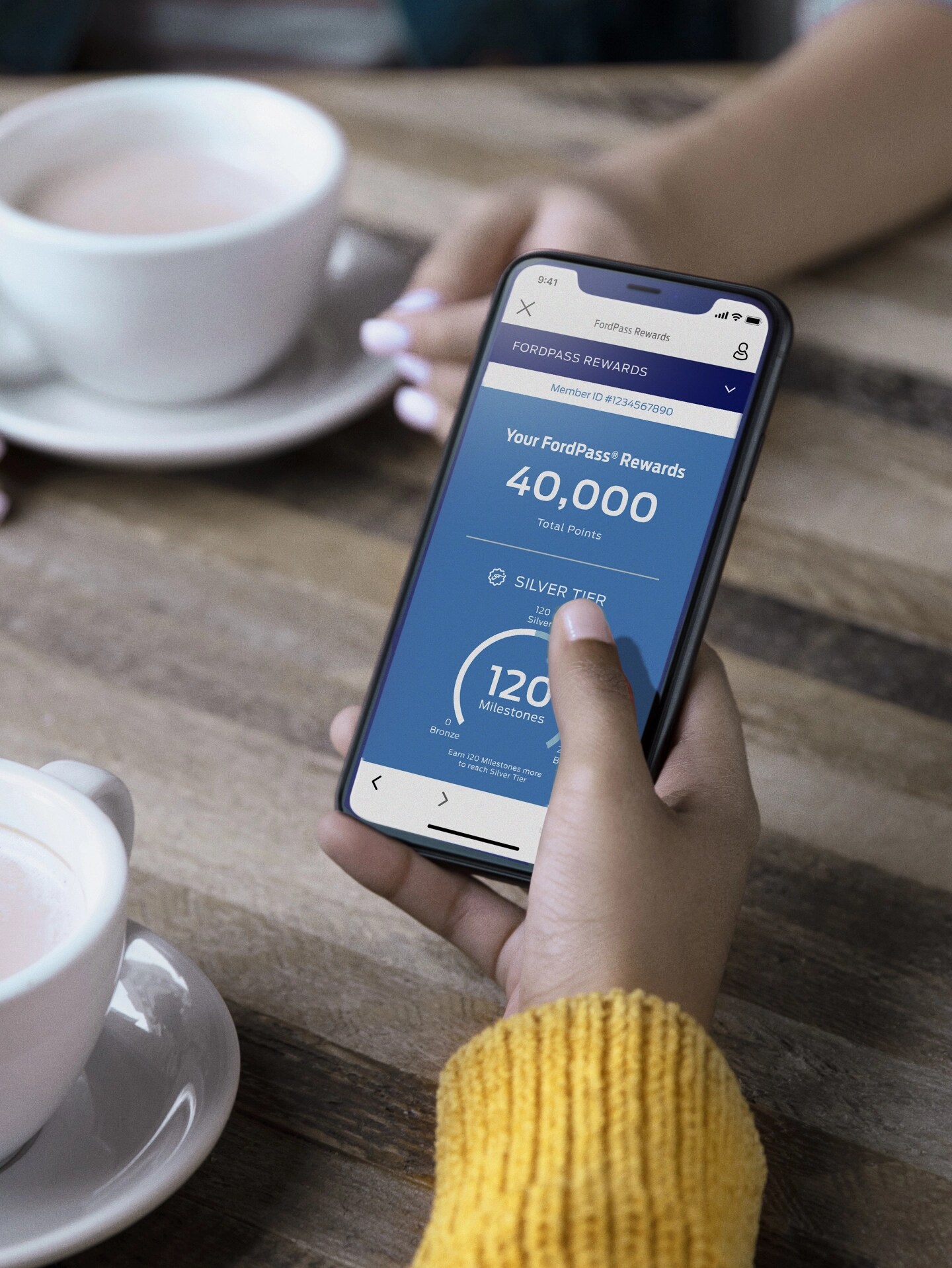 A phone displaying the FordPass Rewards App.