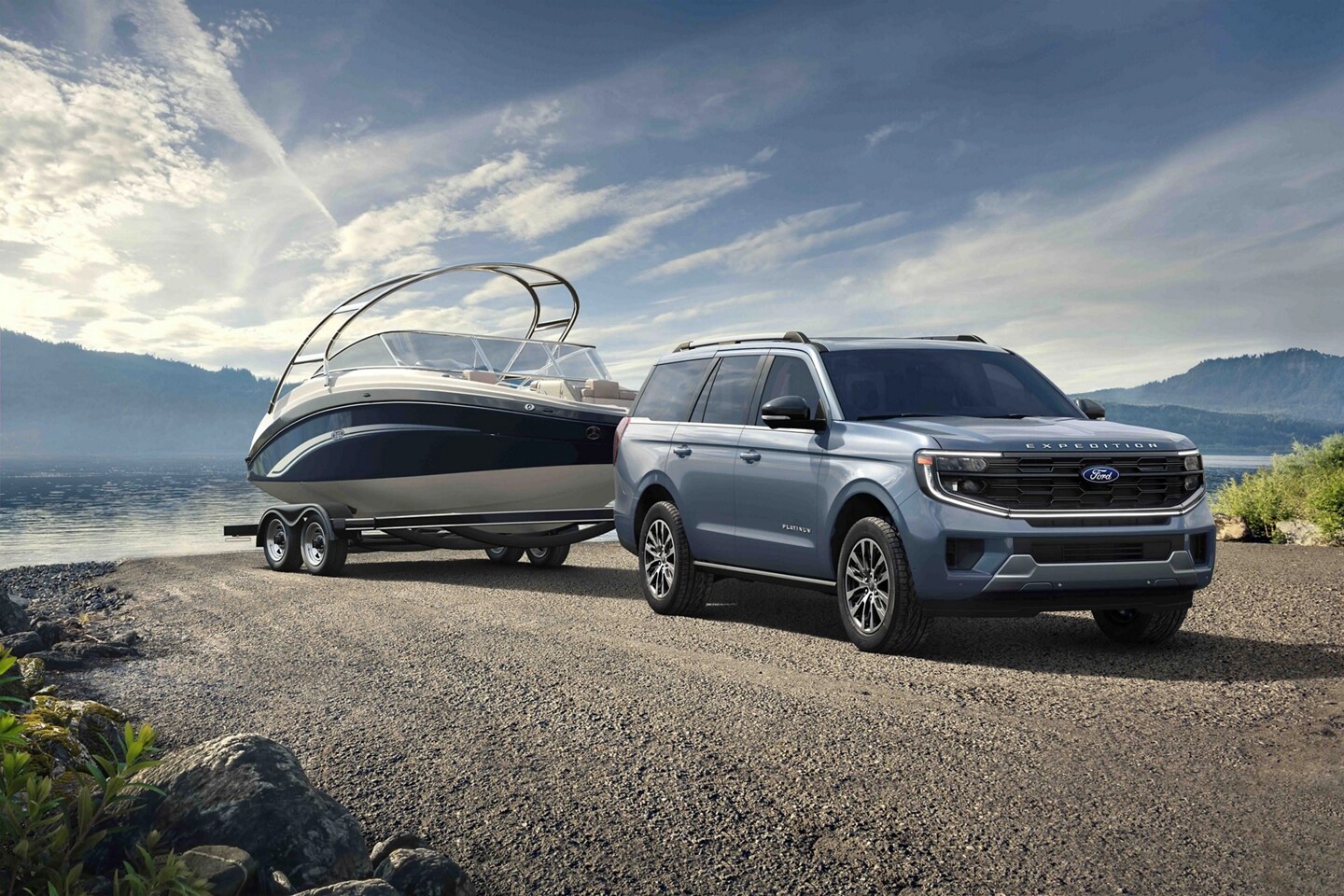 2025 Ford Expedition® model with a driver towing a boat on a trailer