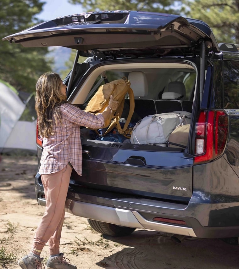 Person loading bags in a 2025 Ford Expedition® MAX SUV with Ford Split Gate