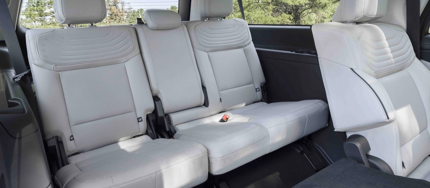 2025 Ford Expedition® Platinum® SUV rear seating area with a seat folded flat