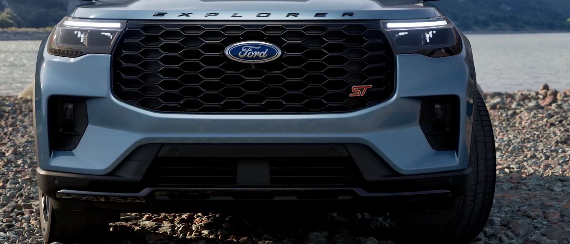 Close-up of black grille and red ST badge on a 2025 Ford Explorer® ST