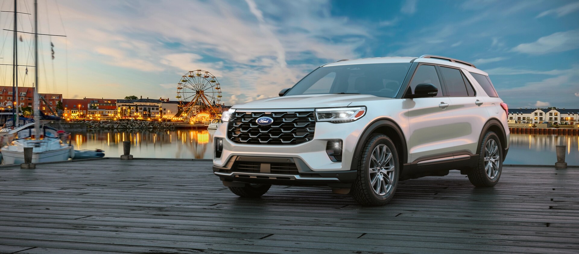 A 2026 Ford Explorer® SUV parked on a pier near an amusement park