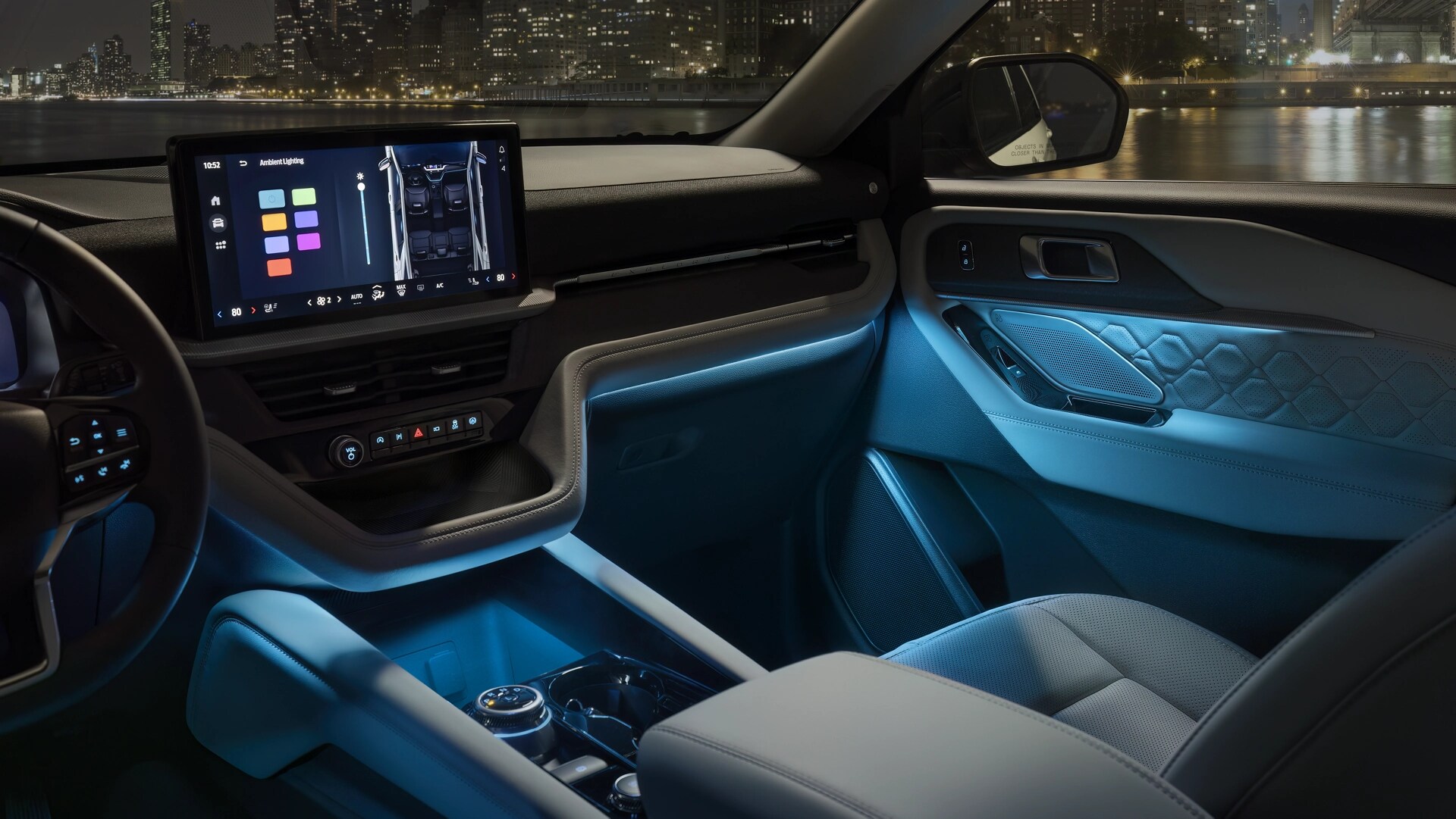 The interior of a 2026 Ford Explorer® SUV with Ambient Lighting on