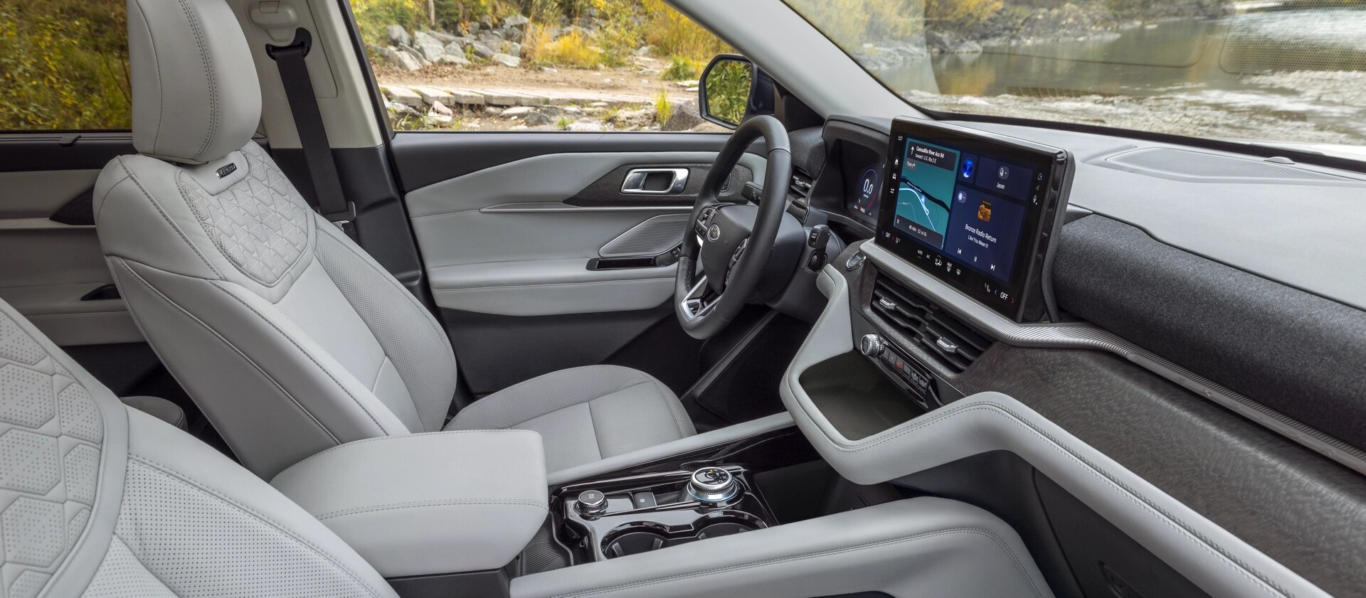 The interior of a 2026 Ford Explorer® Platinum™ SUV, showing the available Lux Leather Package