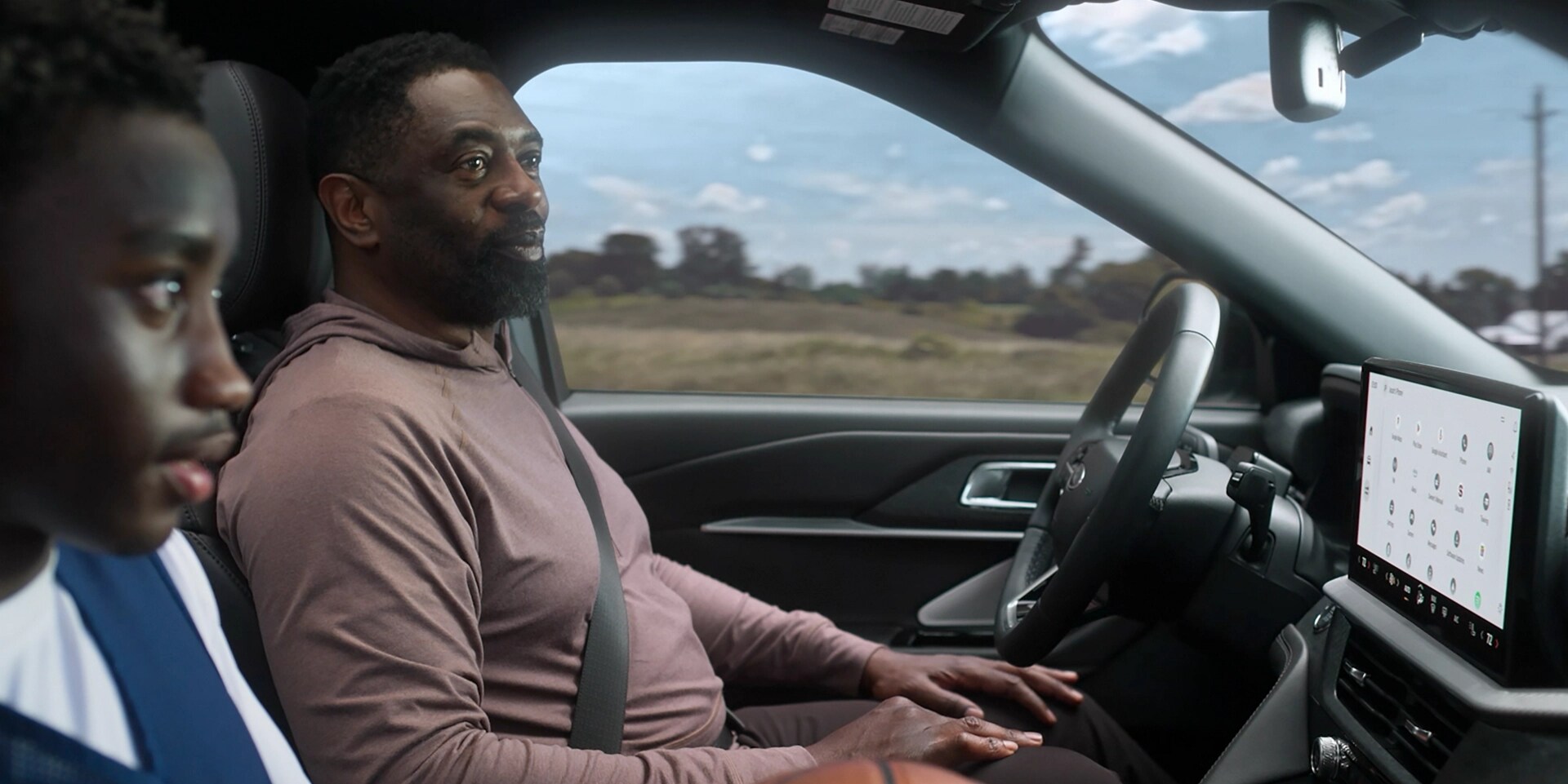 Two men inside a 2026 Ford Explorer® driving