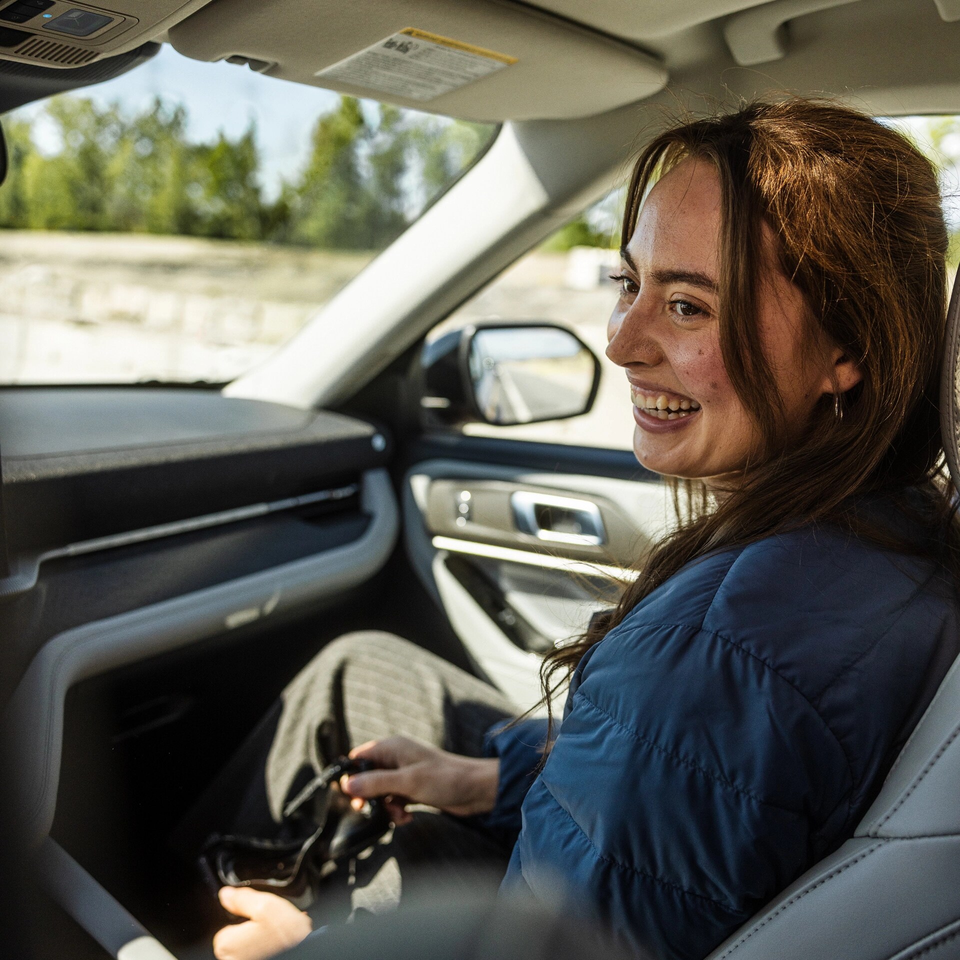 A women in the passenger seat of a 2026 Ford Explorer®