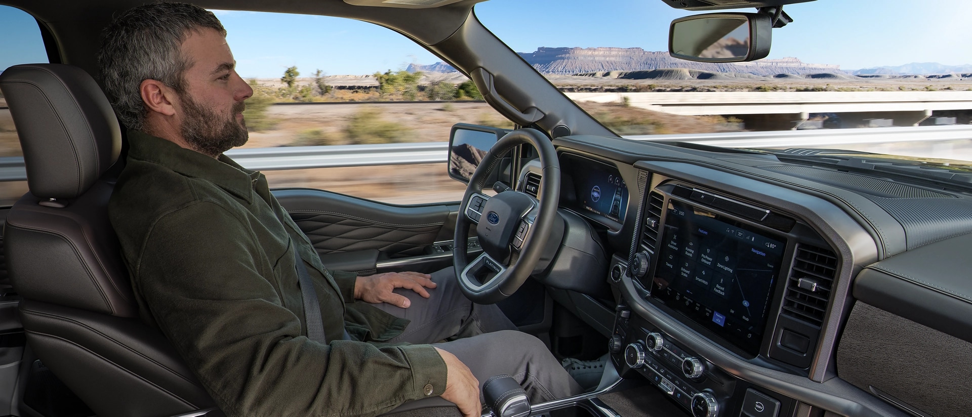 Man using the Ford BlueCruise hands-free driving feature on a 2025 Ford F-150® pickup